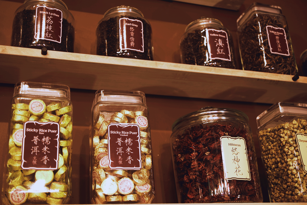 A collection of loose leaf tea jars.